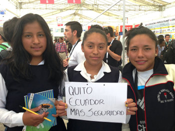 A group of schoolgirls from Quito. Their sign says “more security”.