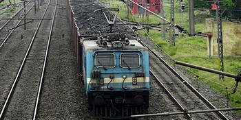 A freight train loaded with coal in India.