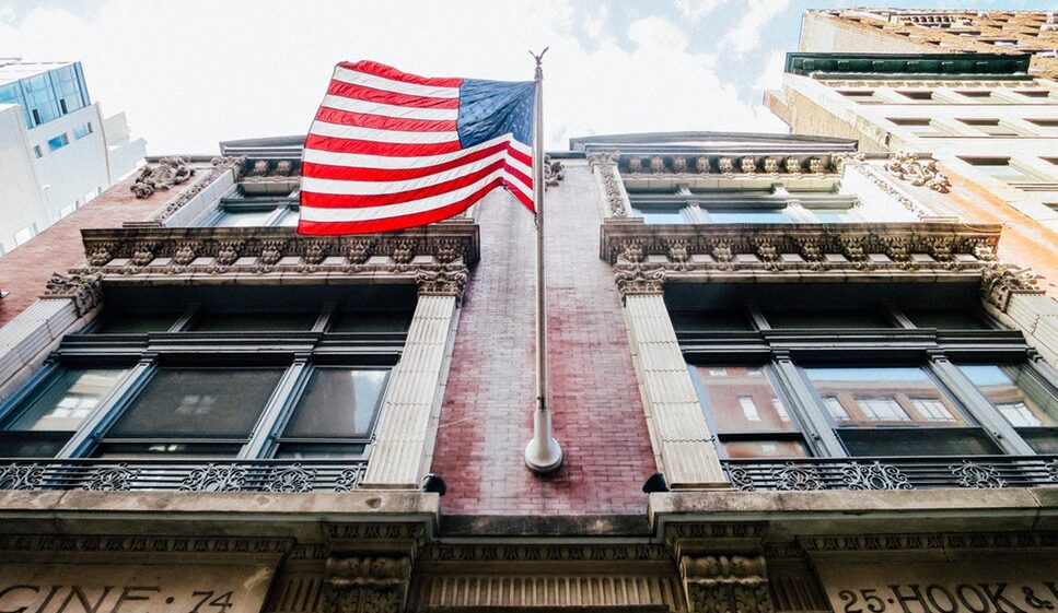 US flag in front of house i New York city