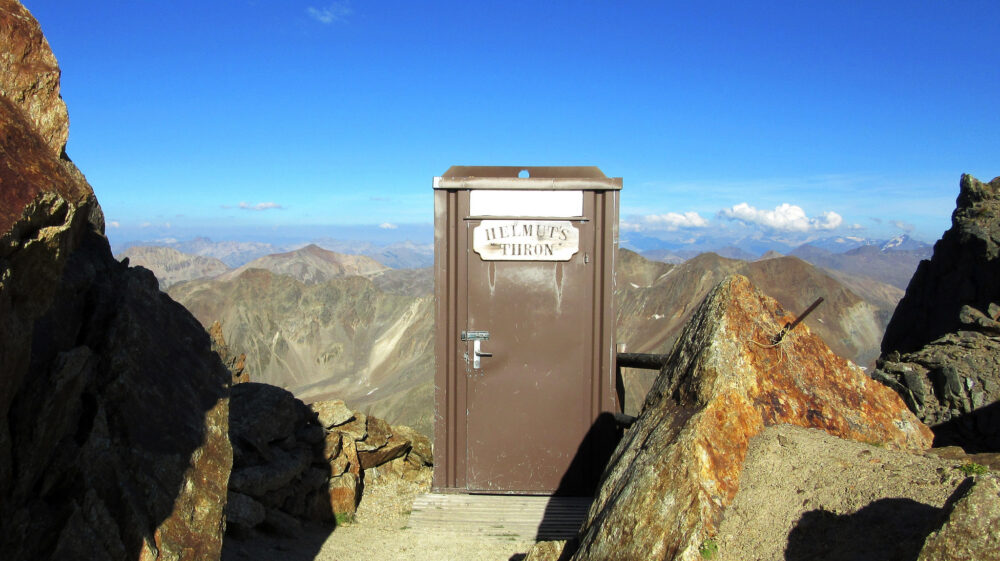 Toilet out-house on top of mountain with view