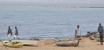 Mozambique beach with fishing boats and fishermen