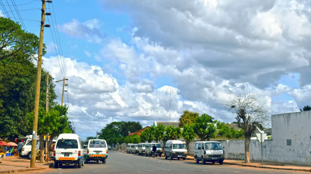 street with some parked cars and buildings
