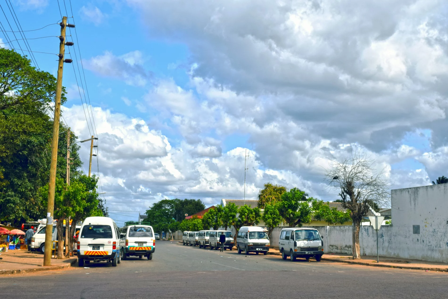 street with some parked cars and buildings