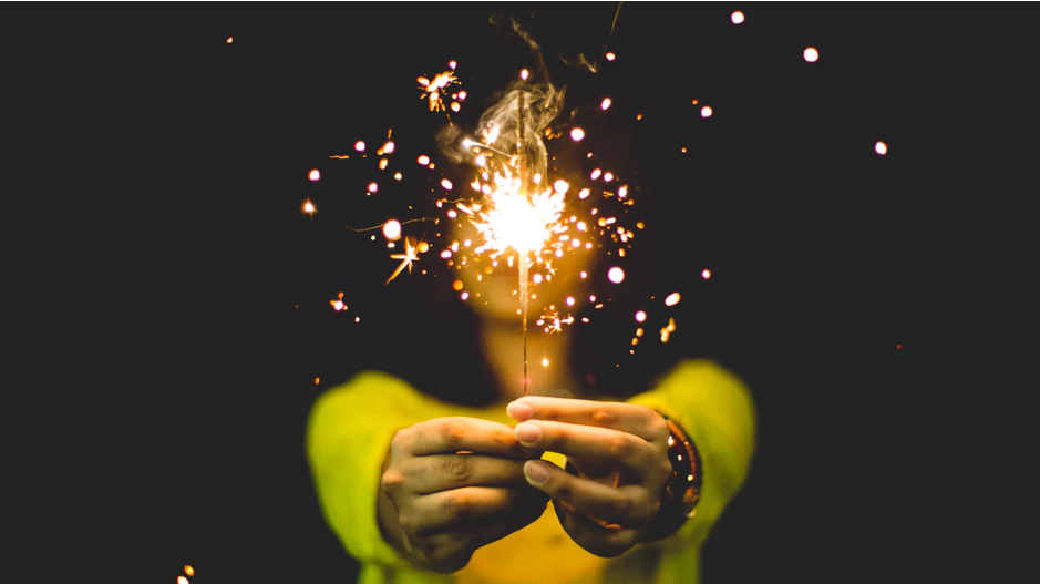 Woman holding sparkle