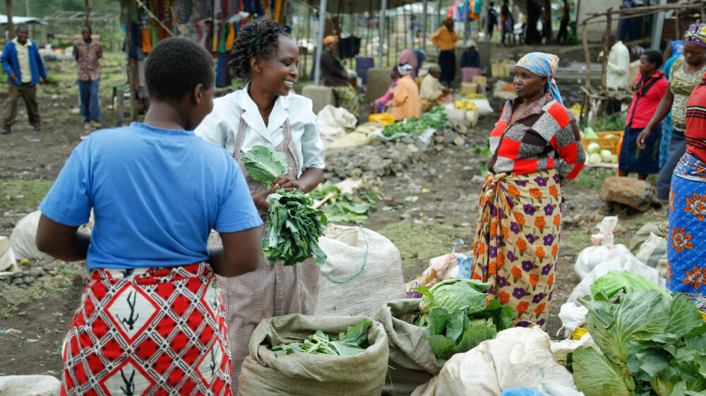 farmers working with bags of produce