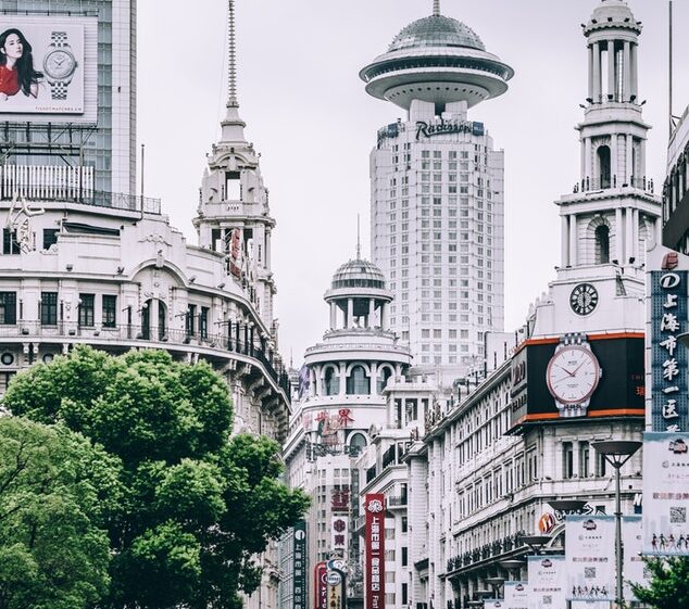 Street in Shanghai, China, office buildings and people