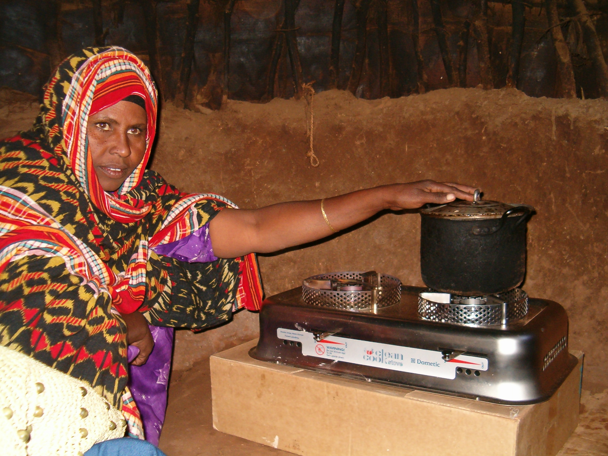 Woman and cookstove. Project Gaia / Flickr