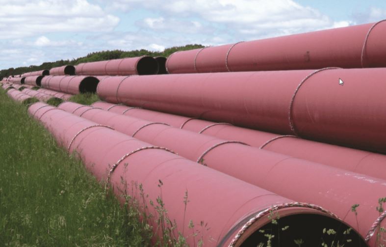 Pipes stacked in a field
