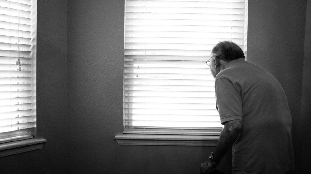 Old man by window