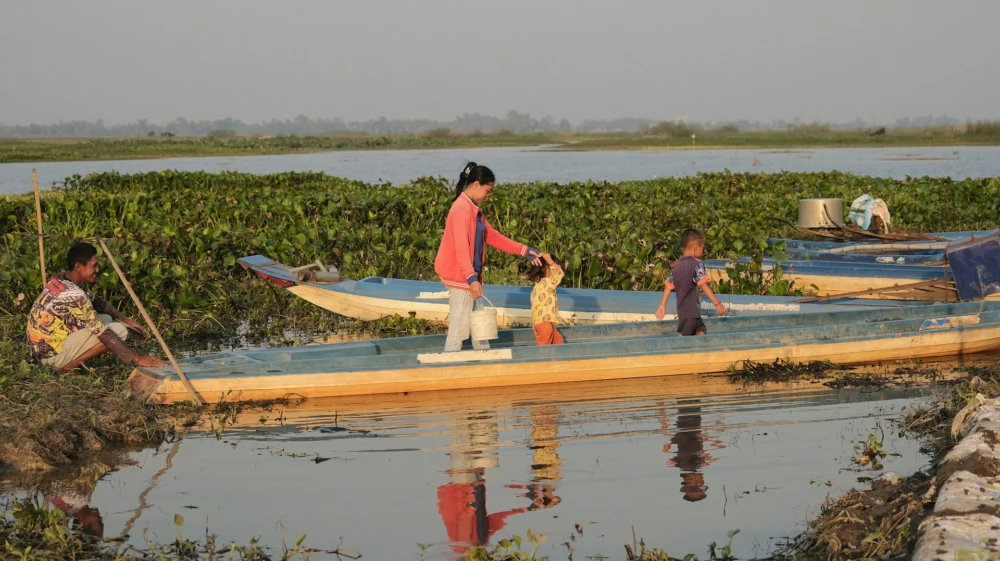 Group of people on a long boat