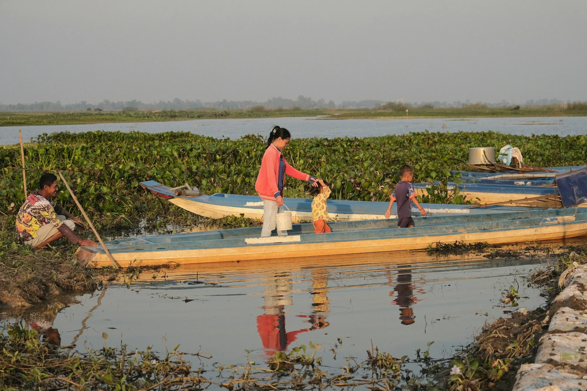 Group of people on a long boat