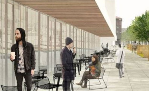A modern street with seating, room for bicycles, and trees