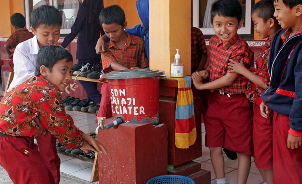 Children in a school in West Java, Indonesia, wash their hands