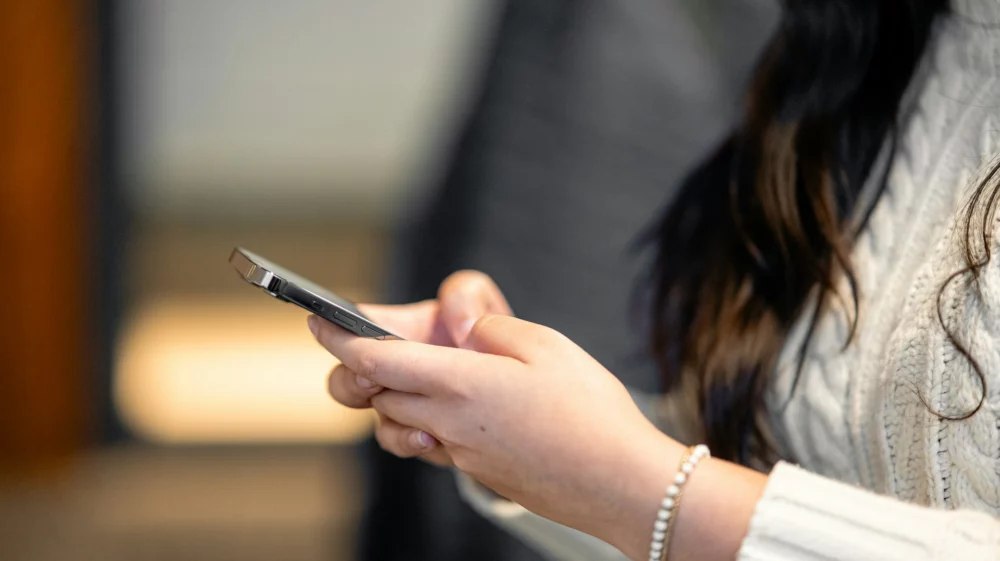 woman holding phone
