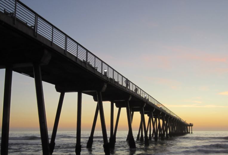 A beach boardwalk in the sunset