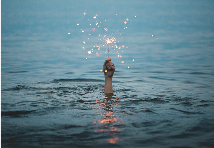 Hand above water