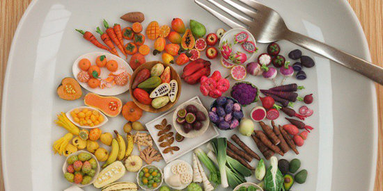 A plate of miniature food and veggies