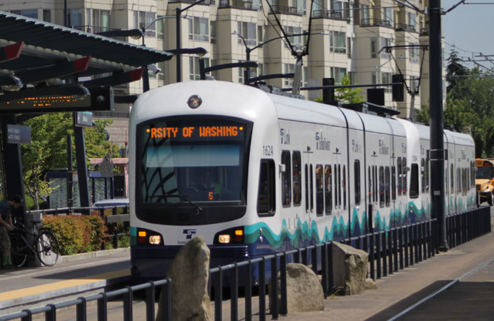 A light rail train in an urban area.