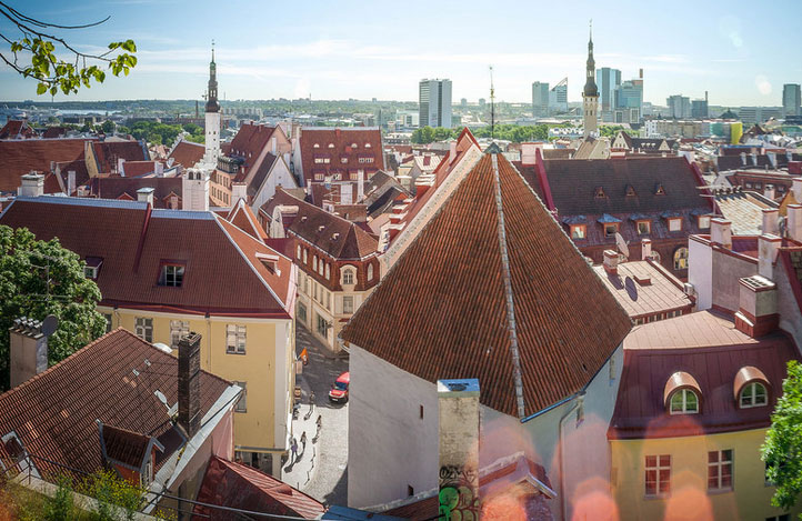 A city of beautiful old buildings with new skyscrapers in the distance