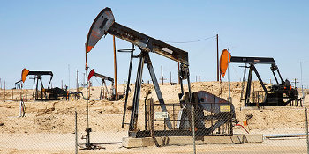 Old pump jacks move up and down in the Kern River Oil Field outside of Bakersfield, CA.