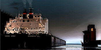 Mesabi Miner, a self-unloading bulk carrier, docks before unloading 50,000 tons of coal for a power plant in Michigan.