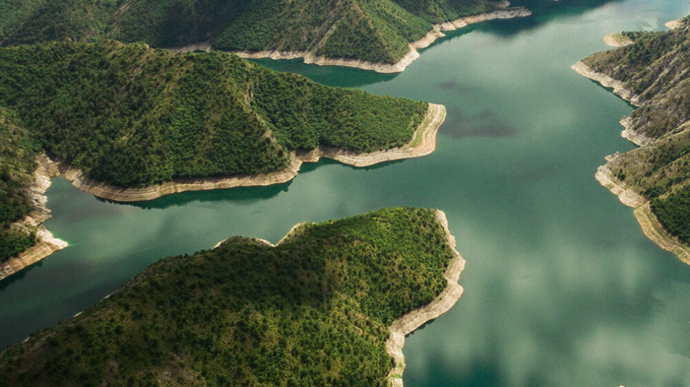 Aerial view of a river amongst mountains