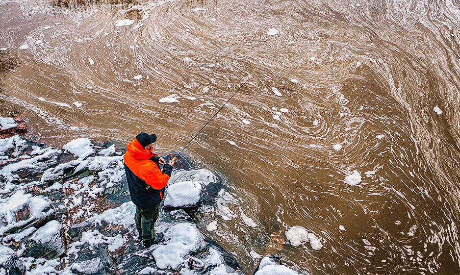 A man fishing in the Baltic Sea region.