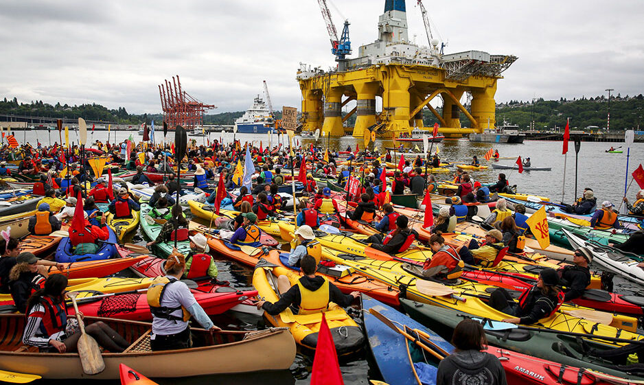 Kayakers protest the passage of Arctic drilling equipment