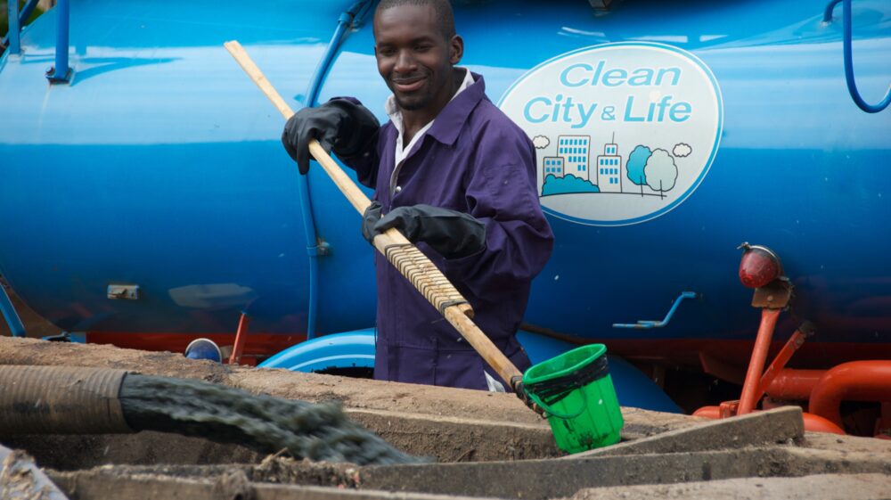 worker in front of truck