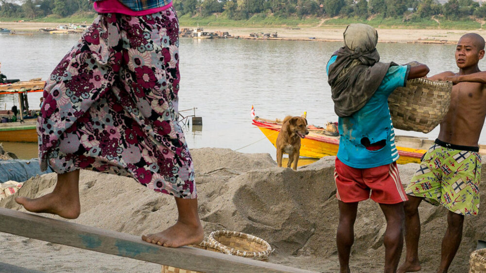 Workers along a river