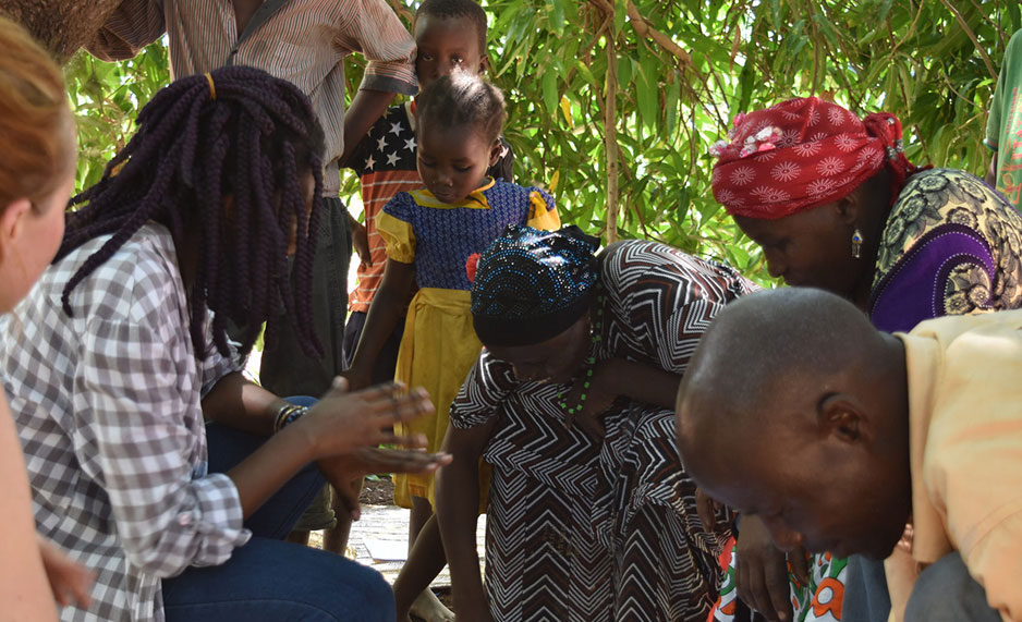A group discussion between farmers and researchers in a mango farm in Kenya.