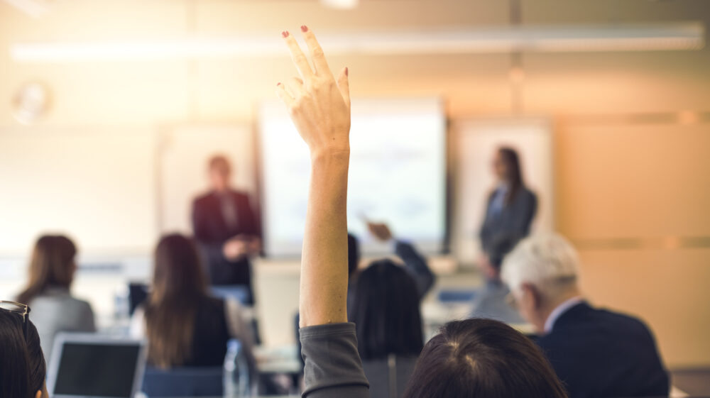 Raised hand, business seminar, education.
