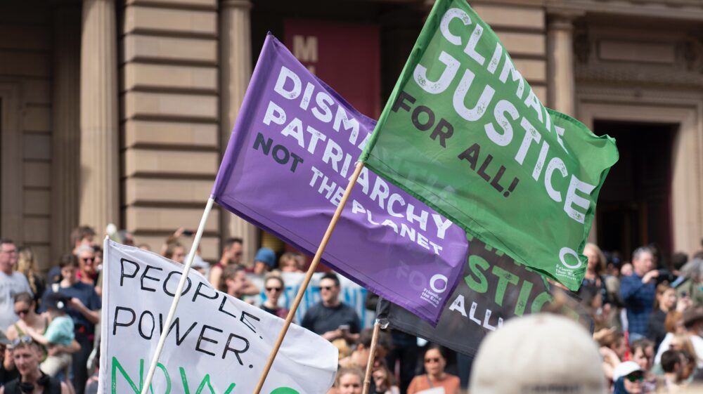 Climate justice for all flags at the Climate Strike Melbourne, Friend of the Earth International