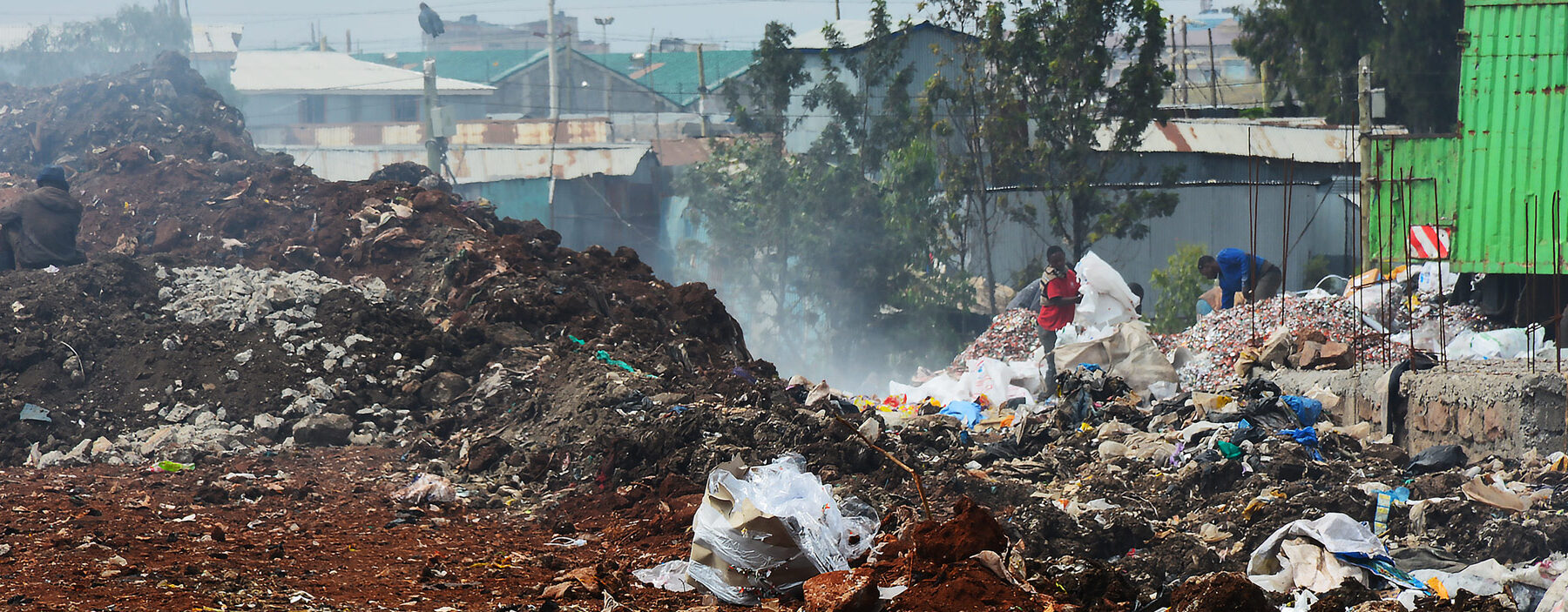 People atop piles of trash in Nairobi