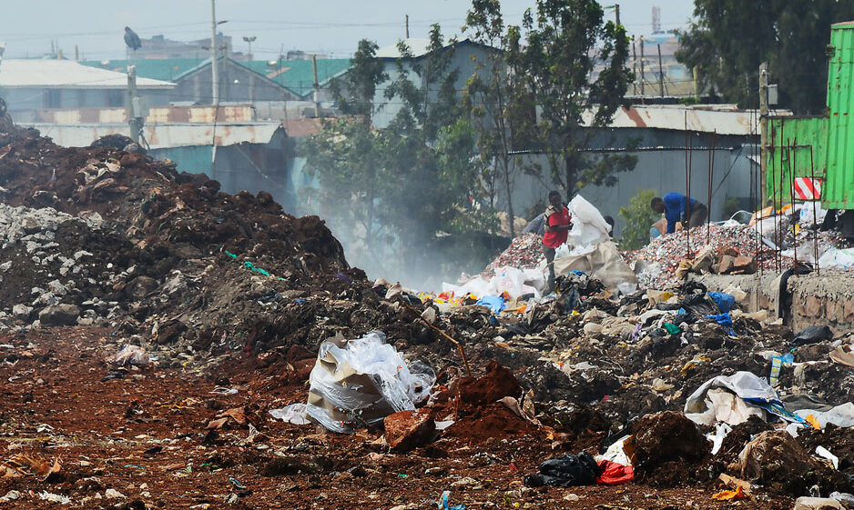 People atop piles of trash in Nairobi