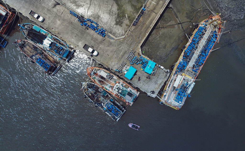 aerial view of fishing boats in a Thai harbour.