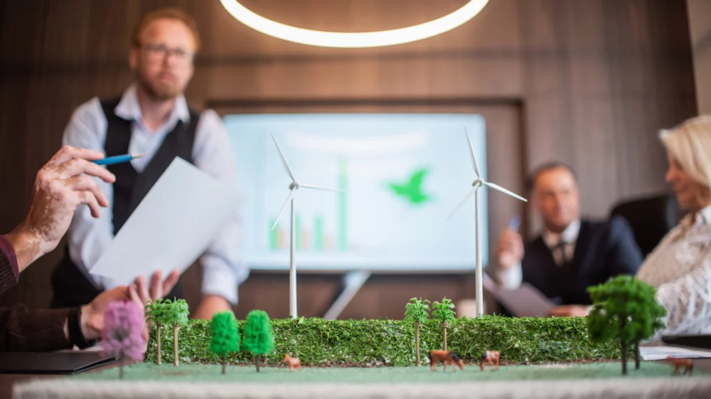 Businessmen talking about wind energy for companies