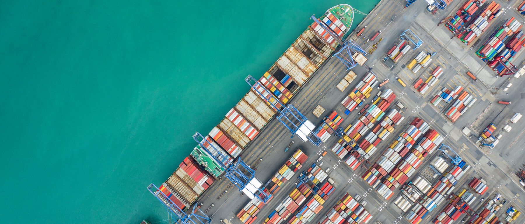 Aerial top view container cargo ship working. Business import export logistic and transportation of International by ship in the open sea.