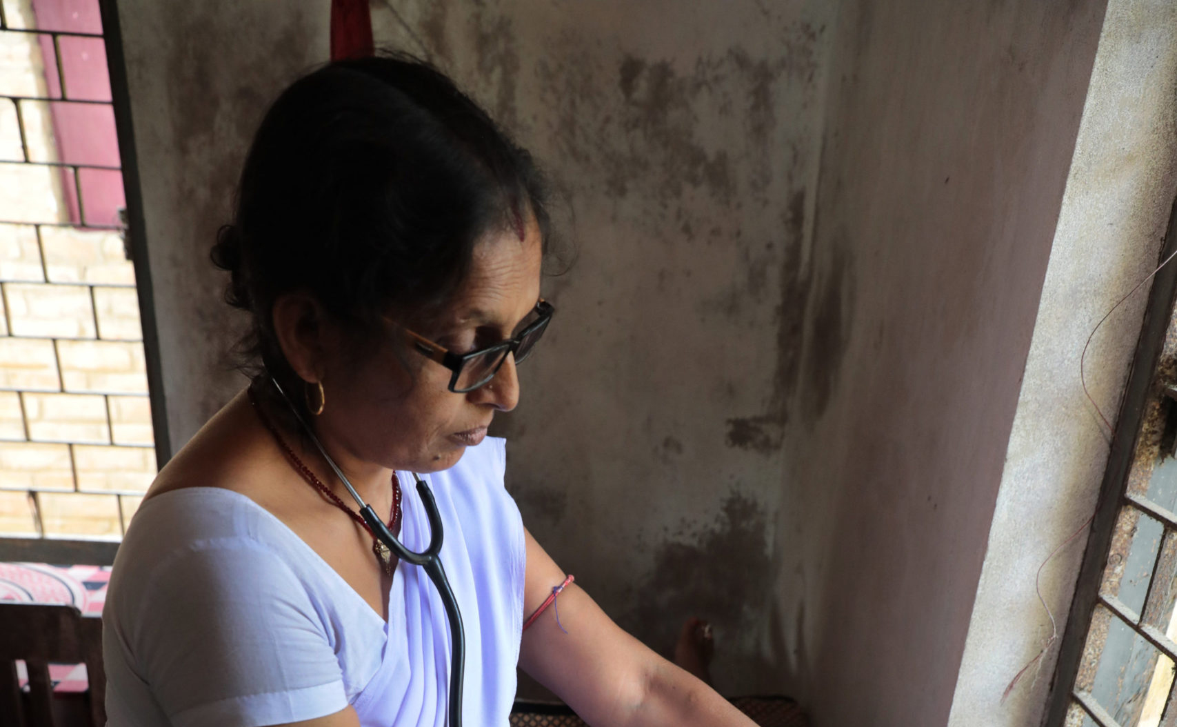 Kamini Kumari, an Auxillary Midwife Nurse, provides medical care to women at a rural health center.