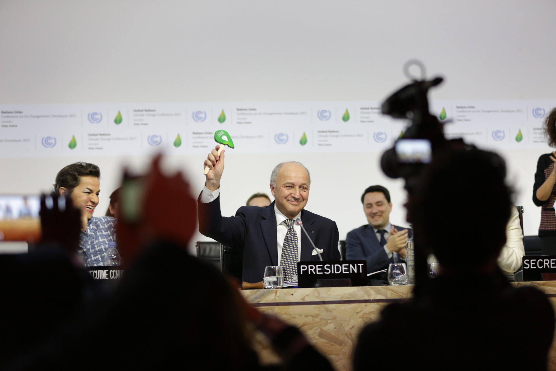 COP21 President Laurent Fabius shows the gavel that came down to seal the Paris Agreement.