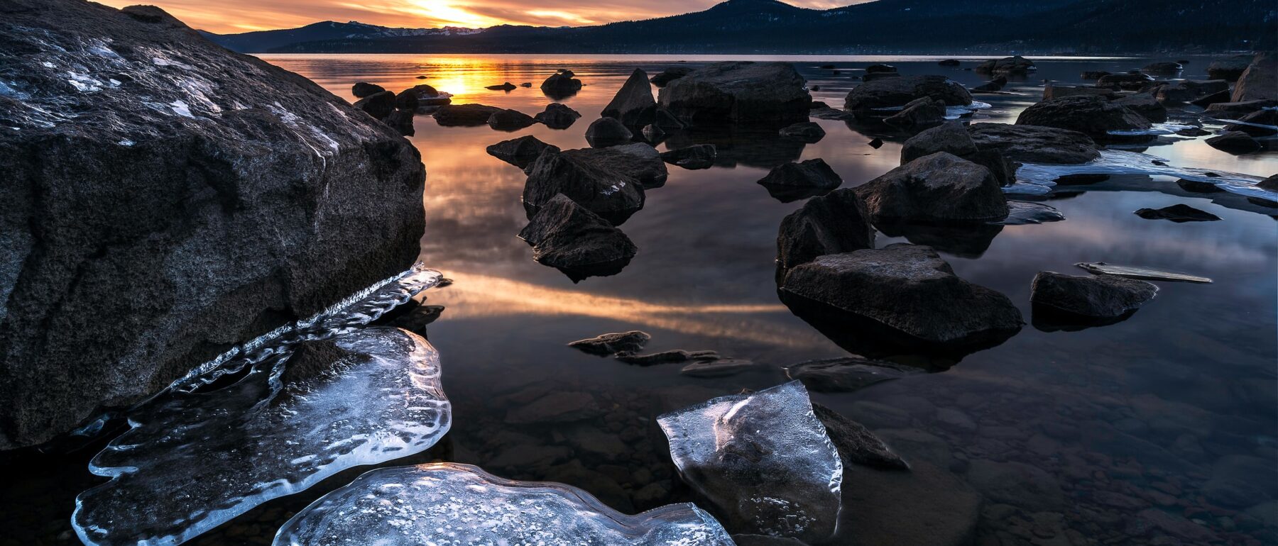 Rocks exposed in lake with receding water levels