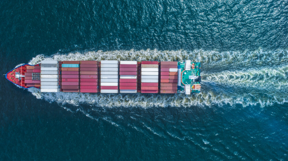 Aerial view of container ship in sea