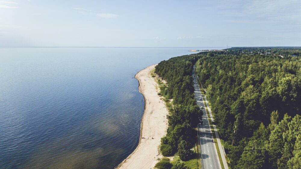 A road runs along the coast shore of the Baltic Sea