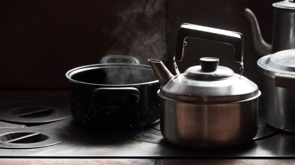 Pans and a kettle on a stove