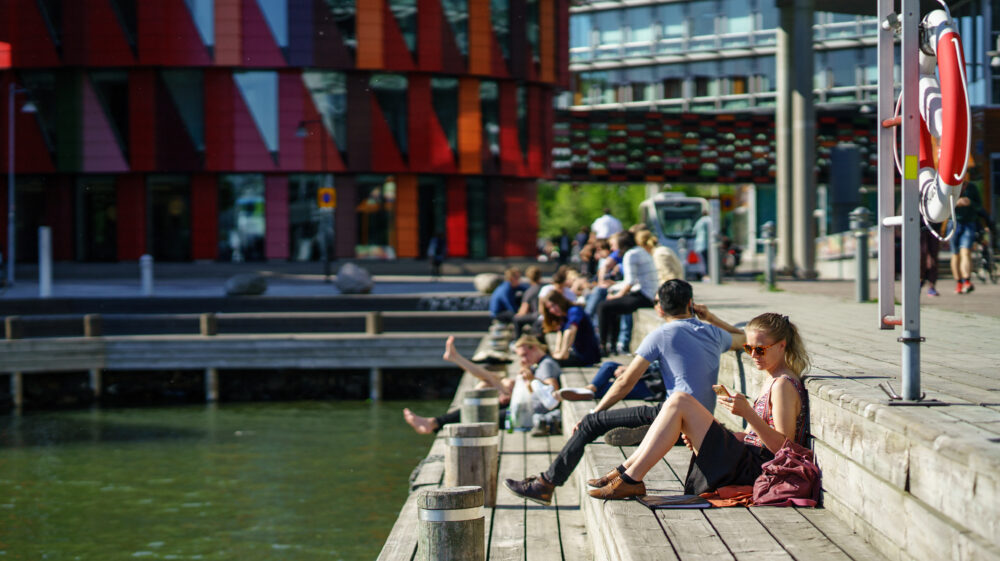 People enjoying the sunshine in Lindholmen Ferry Port