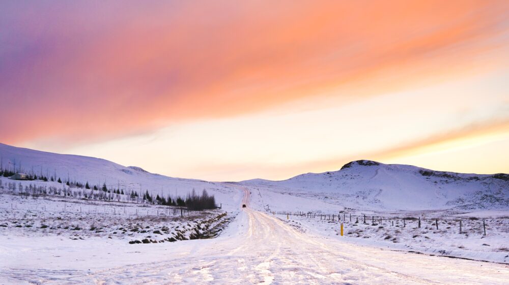Snow-covered field during golden hour, Iceland