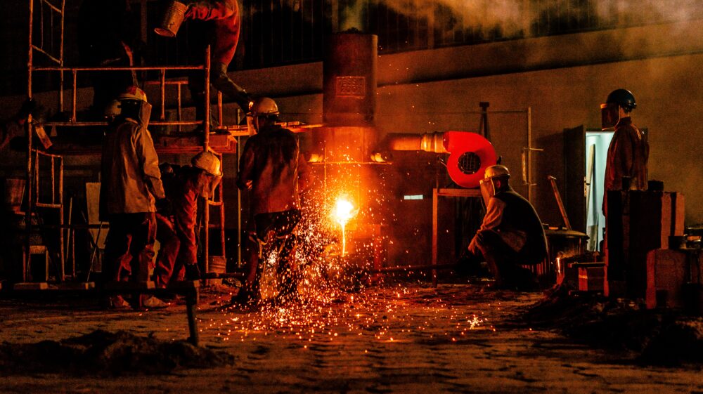 Construction men in front of fire