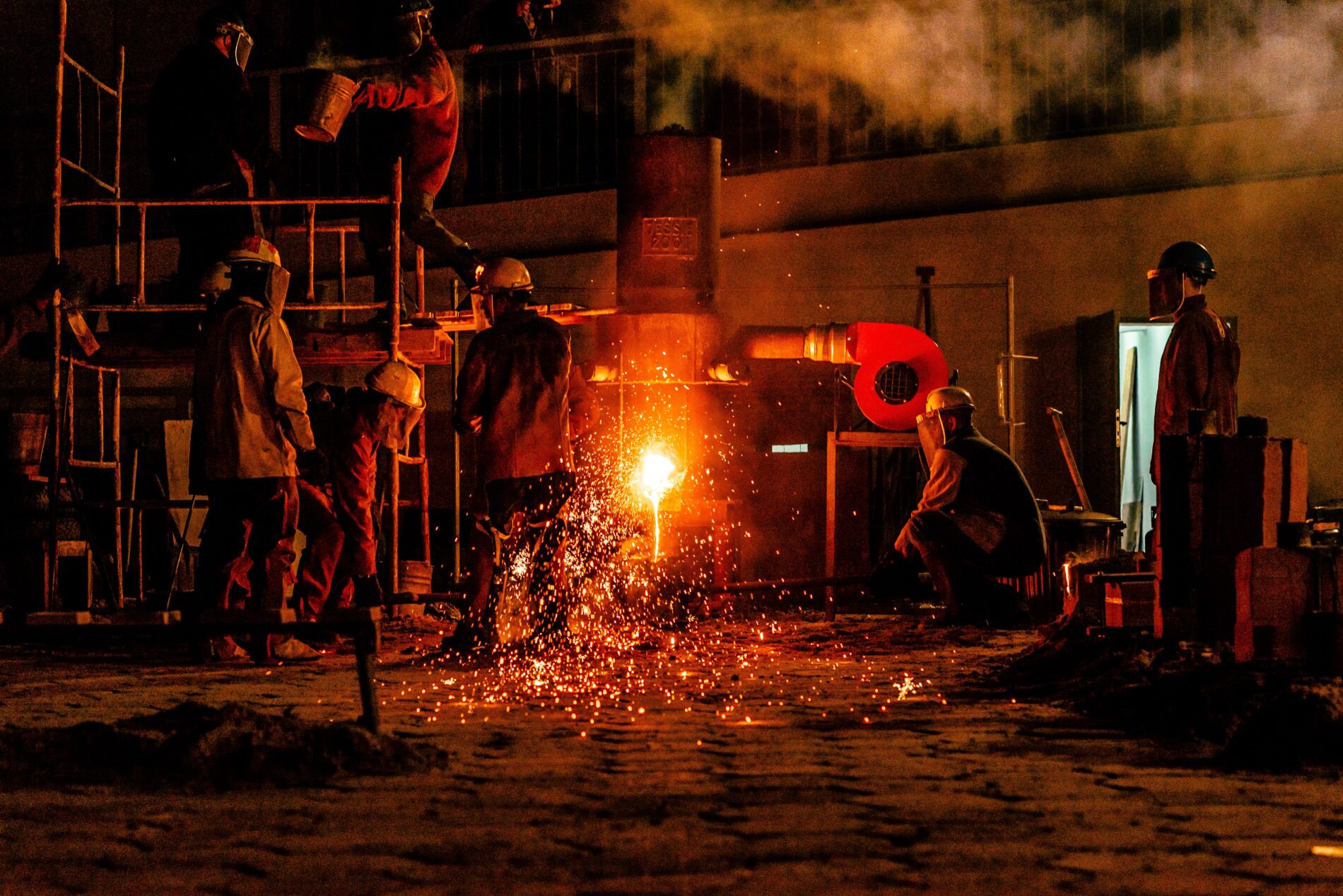Construction men in front of fire