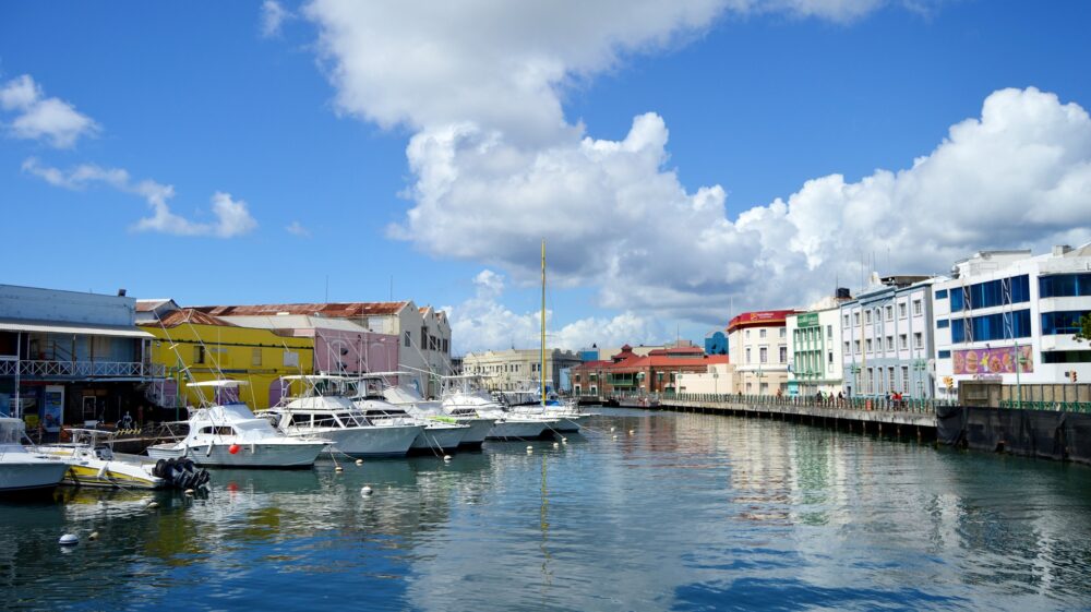 Boats docked on boardwalk-lined Constitution River in Bridgetown, Barbados