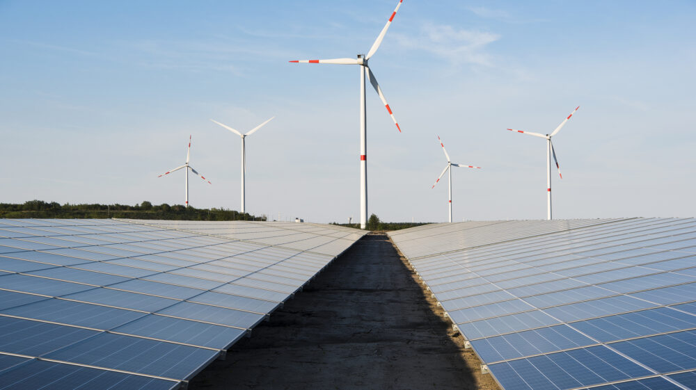 Windmill and solar panels on a blue sky, Lommel, Belgium